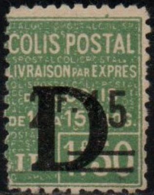 a green and black stamp with the letter d on it