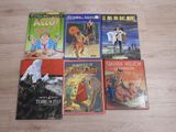 several children ' s books are lined up on a wooden table