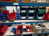 many bins and boxes on the shelves in the warehouse