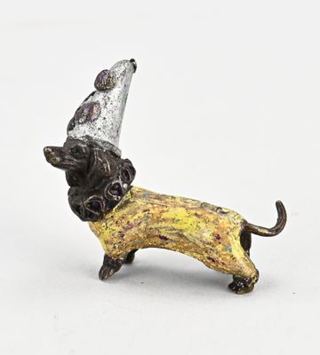 a figurine of a dog wearing a party hat