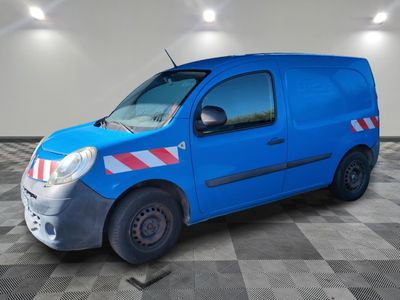 a picture of a blue van parked in a garage