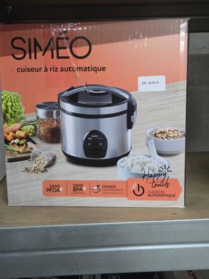 a box of rice cookers on the shelf