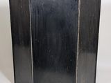 a black metal screen that is on a white surface