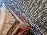 a close up of a piece of wood on the floor