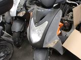 many scooters parked in a parking lot next to each other