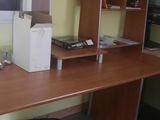 a desk with a computer and a printer on it