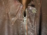 brown leather jacket with zippers on a mannequin mannequin mannequin mannequin mannequin mannequin mannequin mannequin