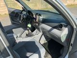 a car that is parked in the lot with the door open