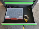 a drawer with a tool box and a tape in it