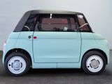 an image of a small blue car in a room