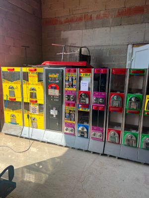 many vending machines lined up in a room