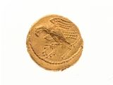an image of a gold coin with a bird on it