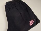 black nike sweatpants with pink nike logo on the side