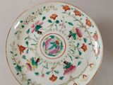 an image of a white plate with flowers and birds on it