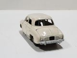 a toy car that is sitting on a white surface
