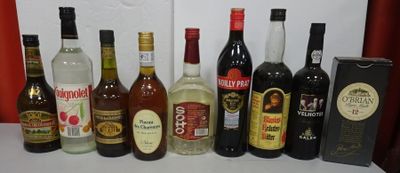 many different types of alcohol bottles lined up on a table