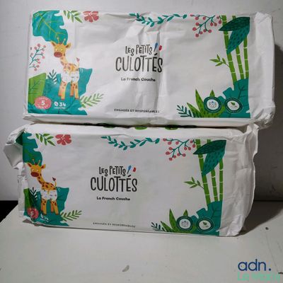 two bags of toilet paper sitting on top of each other