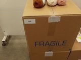 many balls of yarn sitting on top of a carton