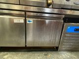 several stainless steel ovens are stacked on top of each other in a kitchen
