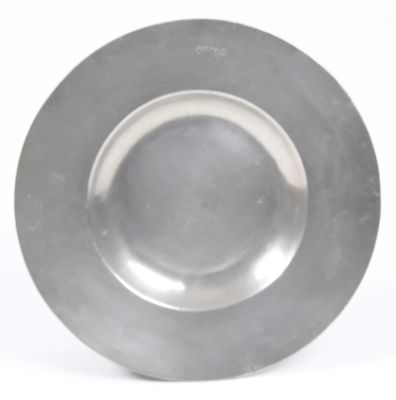 a silver plate on a white surface with a white background
