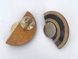 two pieces of wood and metal on a white surface