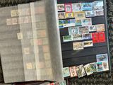 a book with stamps on it sitting on the floor