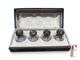 three salt and pepper shakers in a box