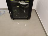 a black cabinet with a keyboard on top of it