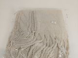 a blanket that is wrapped in plastic on a table