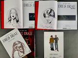 books on a table with a drawing of a man and a woman