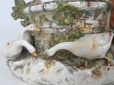 two birds that are sitting on a table