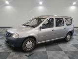 a silver van that is parked on a checkered floor