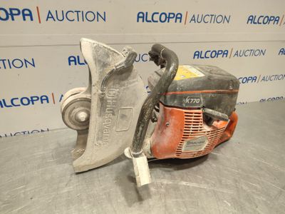 a close up of a chainsaw sitting on top of a table