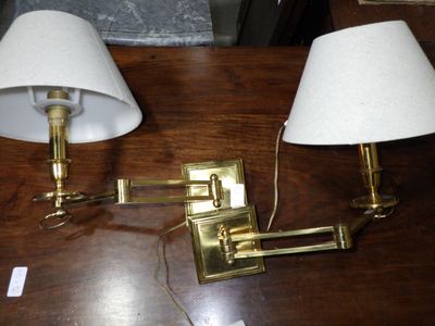 two lamps that are on a table next to each other
