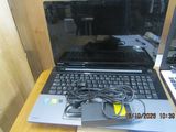 two laptops that are sitting on a table