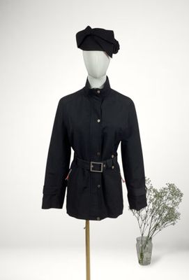 a mannequin wearing a black coat and hat