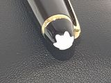 a black pen with a white apple logo on it