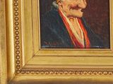 painting of an old man with a red turban in a gold frame