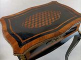 a small table with a chess board on top of it