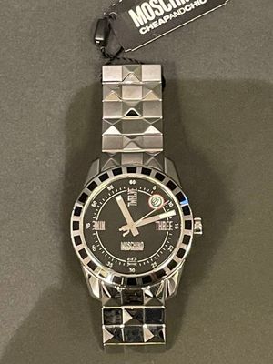 a close up of a watch on display on a table