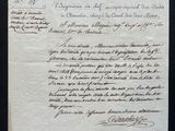an old document with writing on it sitting on top of a table