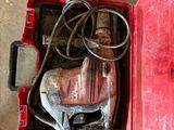 a red tool box with tools in it on the floor