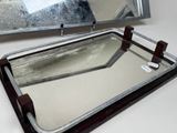 a mirror that is sitting on a table next to a mirror