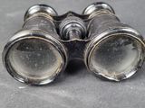 an old pair of binoculars sitting on top of a table