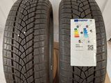 a pair of tires are sitting on top of a cardboard box