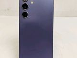 a close up of the back of a purple phone with two camera lenses