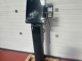 an image of a television on a stand in a garage