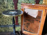 a small table with a mirror on it next to a mirror