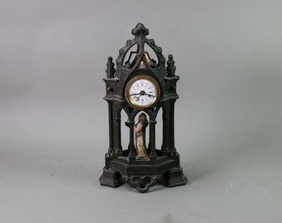 a small clock that is sitting on a table