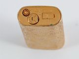 an image of a gold lighter on a white surface